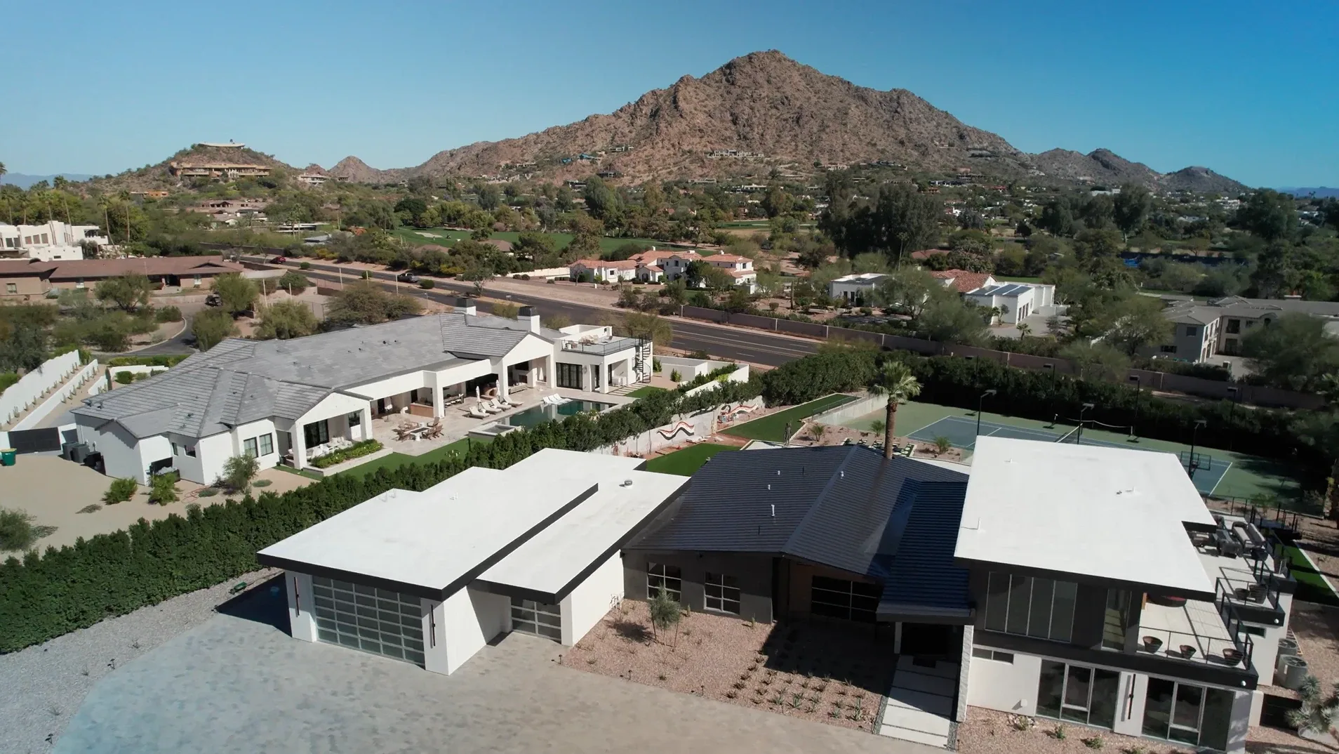 Aerial view of the McConnell residence in Paradise Valley with Camelback Mountain behind it